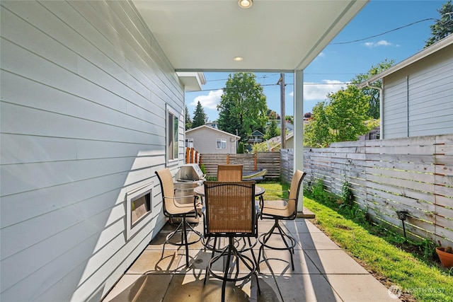 7724 16th Ave SW, Seattle, WA 98106 - fenced backyard with outdoor dining area and a patio area