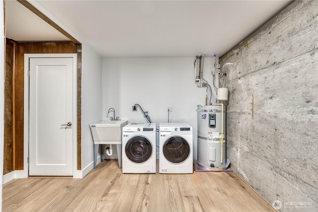 925 Front St S, Issaquah, WA 98027 - laundry room with secured water heater, washing machine and clothes dryer, and light wood-style flooring