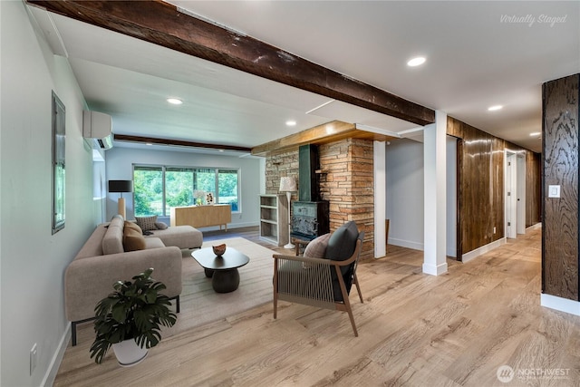 925 Front St S, Issaquah, WA 98027 - living area with a wall unit AC, a wood stove, light wood finished floors, beam ceiling, and recessed lighting