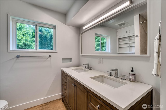925 Front St S, Issaquah, WA 98027 - full bathroom with double vanity, wood finished floors, and a shower
