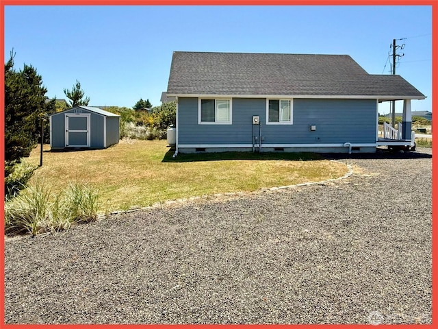 486 Winlock St, Ocean Shores, WA 98569 - rear view of property with a shed, crawl space, and a yard