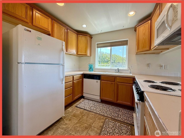 486 Winlock St, Ocean Shores, WA 98569 - kitchen featuring white appliances, light countertops, brown cabinets, recessed lighting, and light tile patterned flooring