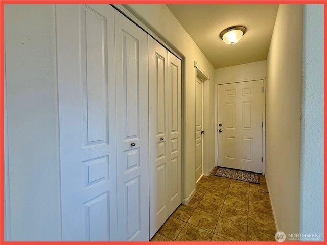 486 Winlock St, Ocean Shores, WA 98569 - doorway to outside featuring baseboards