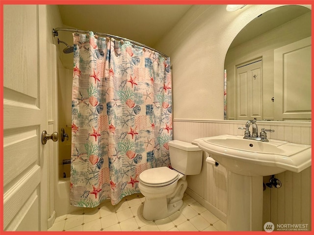 486 Winlock St, Ocean Shores, WA 98569 - bathroom with a wainscoted wall, shower / bath combo, and tile patterned floors