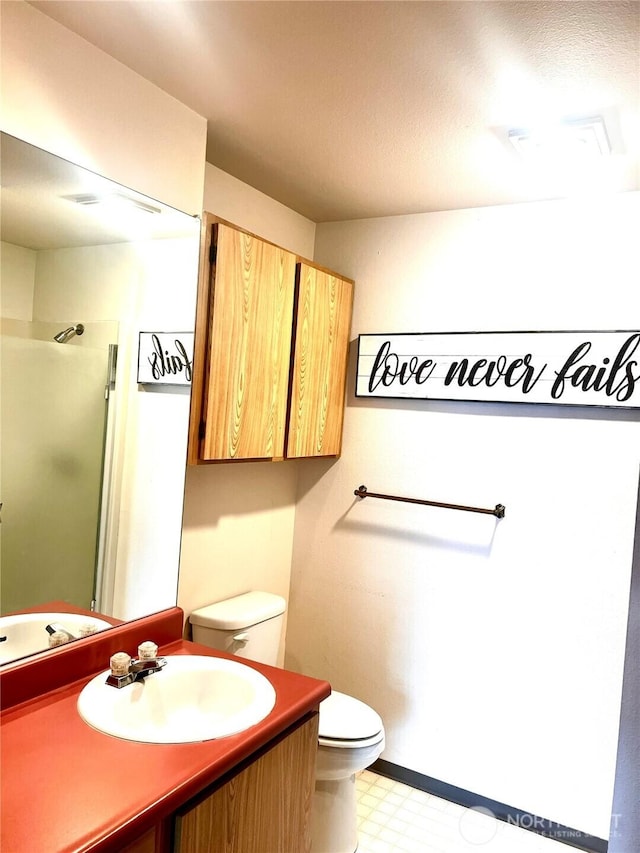 625 N Jackson Ave Unit A9, Tacoma, WA 98406 - bathroom with toilet, vanity, a stall shower, tile patterned floors, and baseboards
