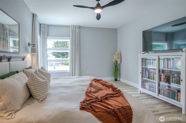 366 Lake View Loop NE, Ocean Shores, WA 98569 - bedroom featuring wood finished floors, baseboards, and a ceiling fan