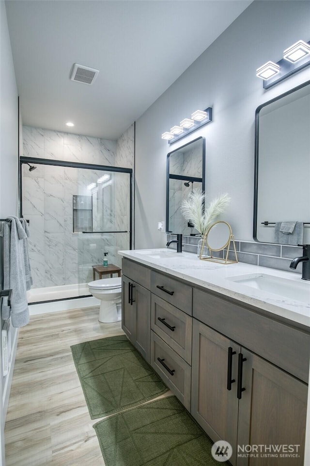 366 Lake View Loop NE, Ocean Shores, WA 98569 - full bath featuring toilet, double vanity, and a marble finish shower
