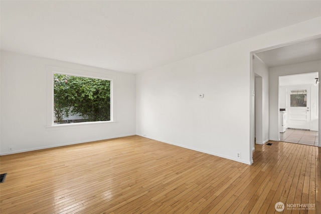 3586 E L St, Tacoma, WA 98404 - empty room featuring light wood finished floors and baseboards