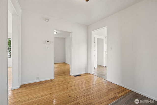 3586 E L St, Tacoma, WA 98404 - unfurnished room with light wood-style floors and baseboards