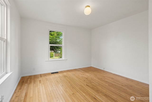 3586 E L St, Tacoma, WA 98404 - spare room featuring light wood-type flooring and baseboards