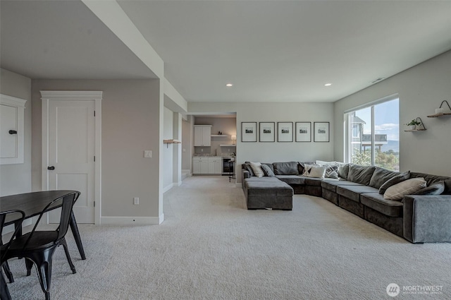 107 Lone Ram Ln, Wenatchee, WA 98801 - living area featuring light carpet, baseboards, and recessed lighting