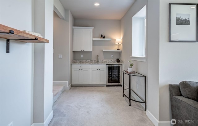 107 Lone Ram Ln, Wenatchee, WA 98801 - indoor wet bar featuring beverage cooler, light colored carpet, baseboards, and recessed lighting