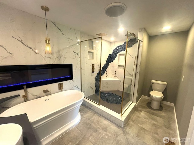 4012 267th St E, Spanaway, WA 98387 - full bathroom featuring toilet, a freestanding tub, a marble finish shower, and baseboards