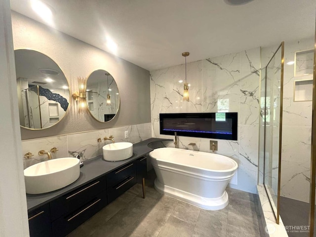 4012 267th St E, Spanaway, WA 98387 - bathroom with tile walls, a freestanding bath, double vanity, and a marble finish shower