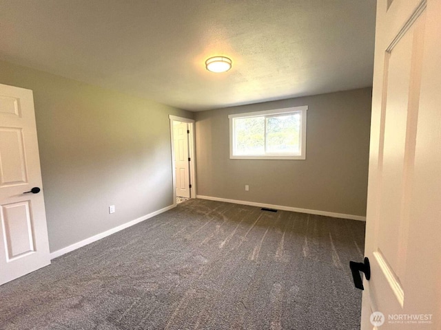 4012 267th St E, Spanaway, WA 98387 - spare room with dark carpet and baseboards