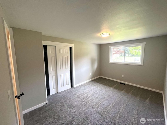 4012 267th St E, Spanaway, WA 98387 - unfurnished bedroom featuring carpet flooring, baseboards, and a closet