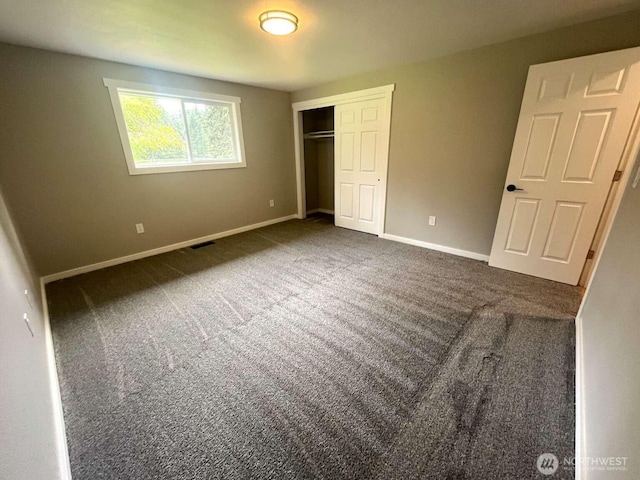 4012 267th St E, Spanaway, WA 98387 - unfurnished bedroom with a closet, baseboards, and carpet floors