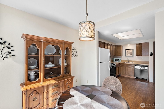 11300 1st Ave NE # 224, Seattle, WA 98125 - dining space featuring dark wood-style floors