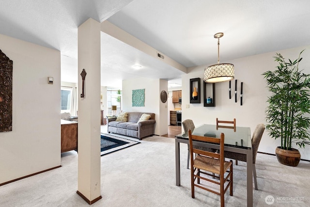 11300 1st Ave NE # 224, Seattle, WA 98125 - dining room with light carpet and baseboards
