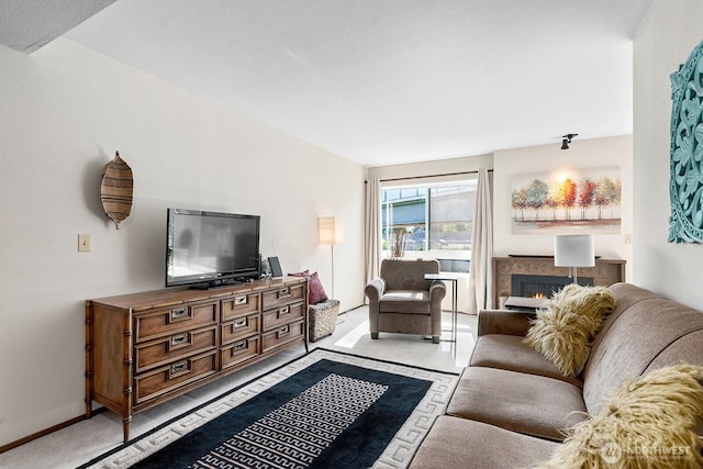 11300 1st Ave NE # 224, Seattle, WA 98125 - living room with a lit fireplace and baseboards