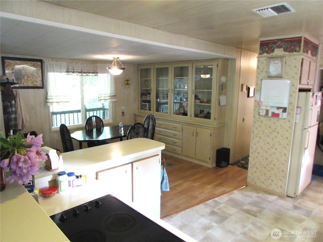 11622 Silver Lake Rd Unit 14, Everett, WA 98208 - kitchen with light floors, light countertops, and glass insert cabinets