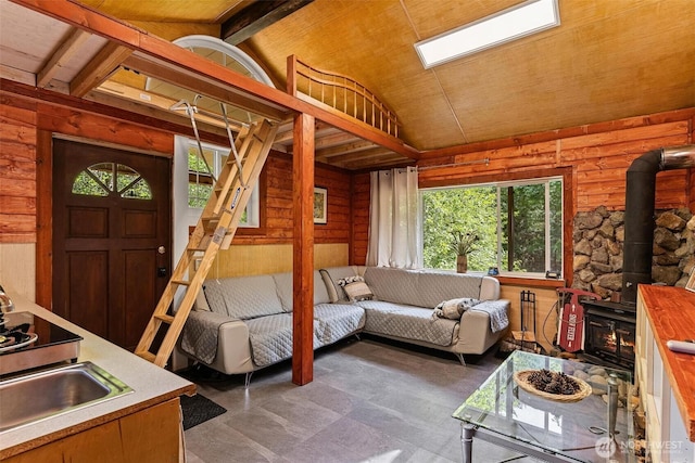 60018 Index Galena Rd, Sultan, WA 98294 - living area with a wood stove, lofted ceiling, and healthy amount of natural light