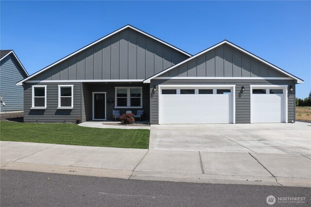 6354 Murray Way NE, Moses Lake, WA 98837 - craftsman inspired home featuring a garage, board and batten siding, concrete driveway, and a front lawn