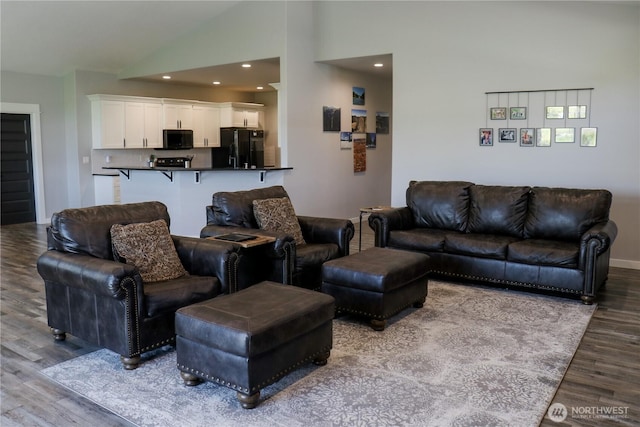 6354 Murray Way NE, Moses Lake, WA 98837 - living area featuring wood finished floors, baseboards, lofted ceiling, and recessed lighting