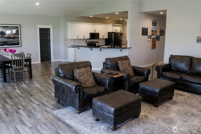 6354 Murray Way NE, Moses Lake, WA 98837 - living room featuring wood finished floors, recessed lighting, baseboards, and lofted ceiling