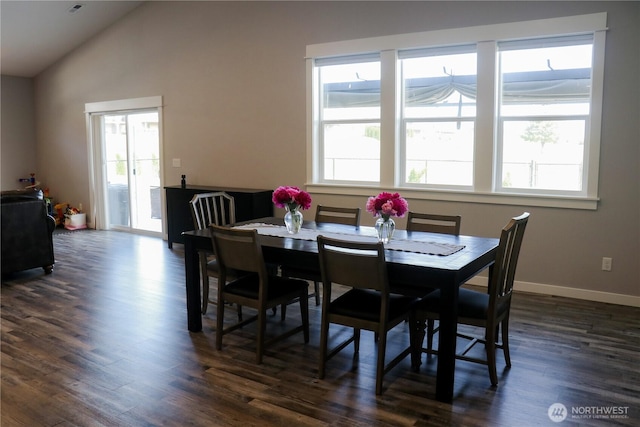 6354 Murray Way NE, Moses Lake, WA 98837 - dining area featuring dark wood finished floors, vaulted ceiling, and baseboards