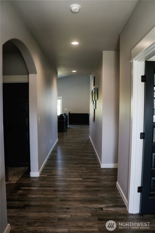 6354 Murray Way NE, Moses Lake, WA 98837 - hallway featuring baseboards, dark wood-type flooring, arched walkways, and recessed lighting