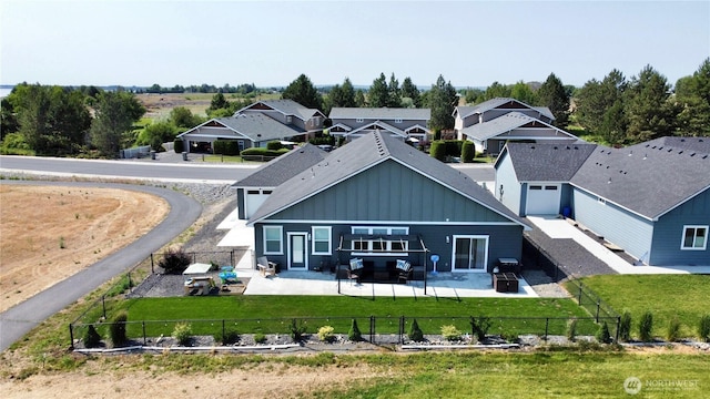 6354 Murray Way NE, Moses Lake, WA 98837 - rear view of property featuring board and batten siding, a patio area, and a residential view