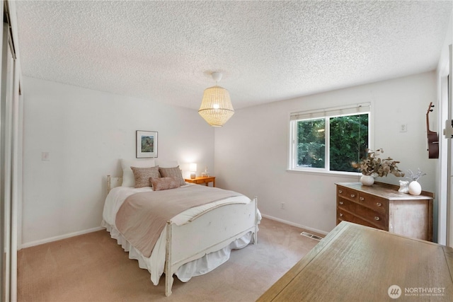 1902 Tellkamp Rd NE, Olympia, WA 98506 - bedroom with a textured ceiling, light colored carpet, and baseboards