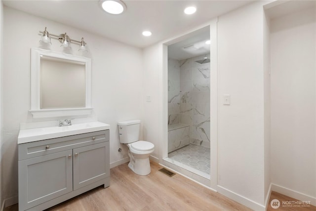 1902 Tellkamp Rd NE, Olympia, WA 98506 - bathroom featuring toilet, a marble finish shower, vanity, wood finished floors, and recessed lighting