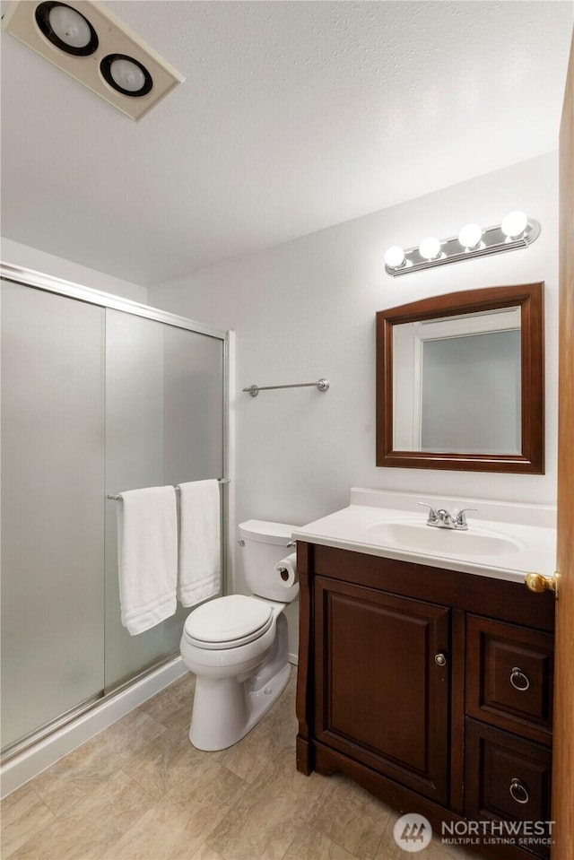1902 Tellkamp Rd NE, Olympia, WA 98506 - bathroom with vanity, a shower stall, and toilet