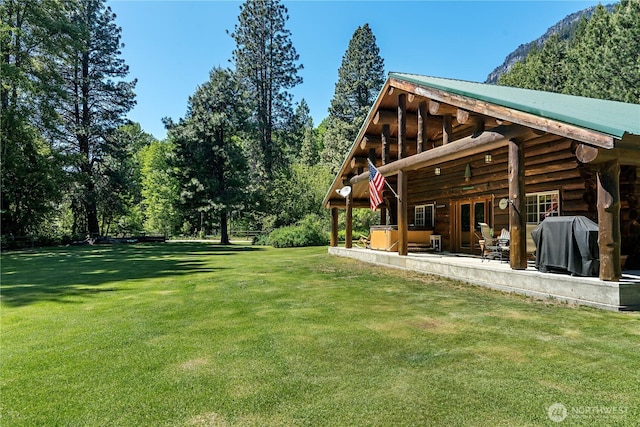 18680 US Highway 2, Lake Wenatchee, WA 98826 - view of green lawn featuring a hot tub and a patio area