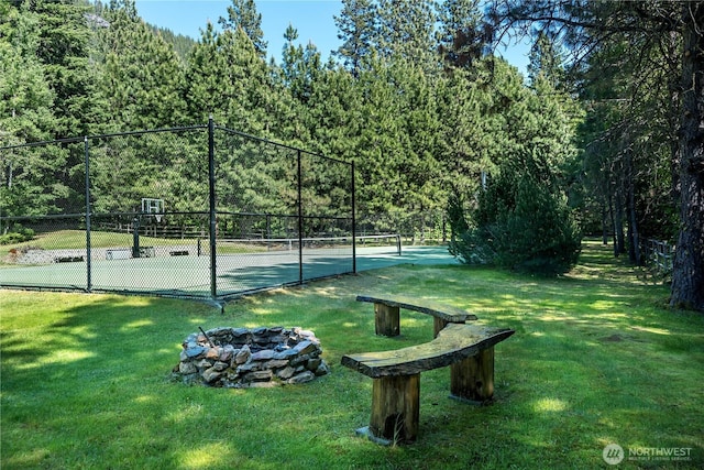 18680 US Highway 2, Lake Wenatchee, WA 98826 - view of tennis court featuring a fire pit and a wooded view