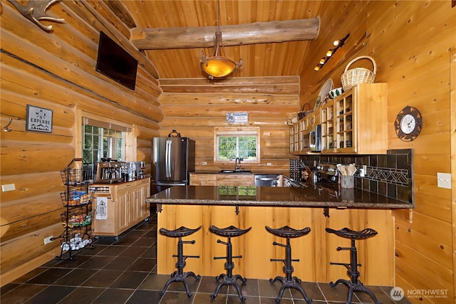 18680 US Highway 2, Lake Wenatchee, WA 98826 - kitchen featuring wooden ceiling, rustic walls, a sink, stainless steel appliances, and glass insert cabinets
