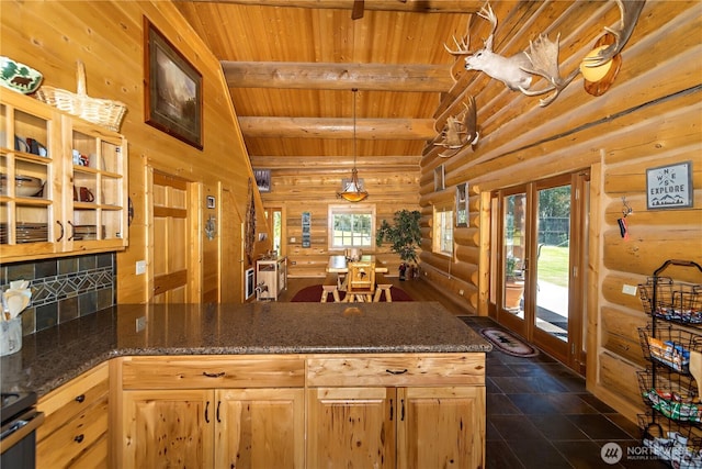 18680 US Highway 2, Lake Wenatchee, WA 98826 - kitchen featuring wooden ceiling with exposed beams, rustic walls, a peninsula, dark stone counters, and open shelves