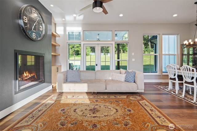 19428 NE 259th St S, Battle Ground, WA 98604 - living area featuring wood finished floors, a glass covered fireplace, recessed lighting, and a ceiling fan