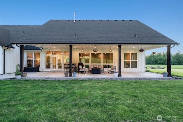 19428 NE 259th St S, Battle Ground, WA 98604 - back of house featuring french doors, roof with shingles, board and batten siding, and a patio