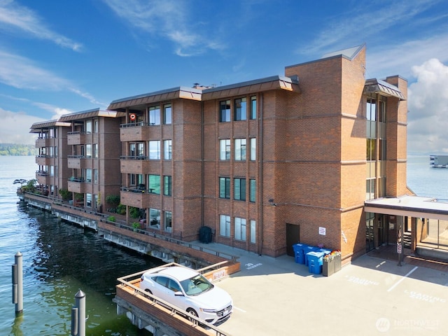 2330 43rd Ave E Unit 403B, Seattle, WA 98112 - view of apartment building / complex featuring a water view