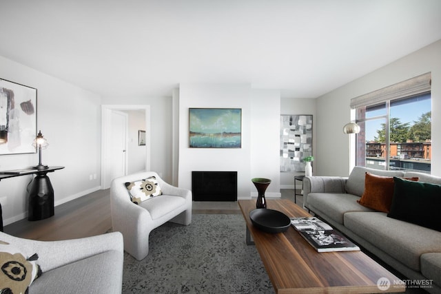 2330 43rd Ave E Unit 403B, Seattle, WA 98112 - living area with wood finished floors, a fireplace with flush hearth, and baseboards