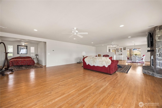 29 Barn Dance Dr, Pateros, WA 98846 - living area featuring ceiling fan, light wood-type flooring, healthy amount of natural light, recessed lighting, and a stone fireplace