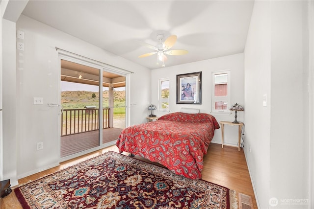 29 Barn Dance Dr, Pateros, WA 98846 - bedroom with access to outside, multiple windows, and wood finished floors