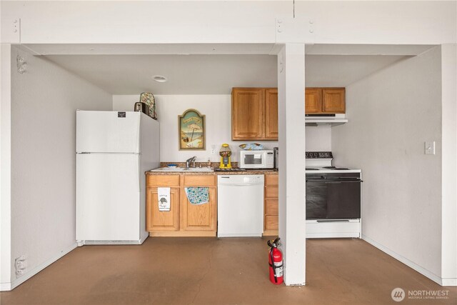 29 Barn Dance Dr, Pateros, WA 98846 - kitchen with white appliances, under cabinet range hood, finished concrete flooring, and brown cabinets