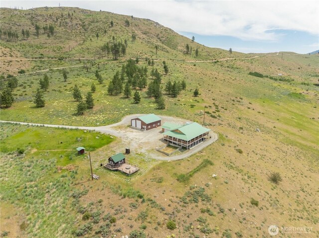 29 Barn Dance Dr, Pateros, WA 98846 - aerial overview of property's location with a mountainous background and rural landscape
