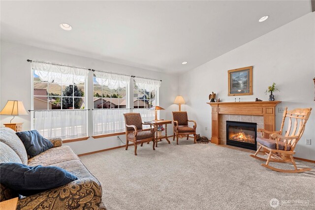 1600 Brandi Ct, Wenatchee, WA 98801 - living room featuring carpet floors, vaulted ceiling, a tiled fireplace, baseboards, and recessed lighting