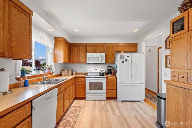 1600 Brandi Ct, Wenatchee, WA 98801 - kitchen with white appliances, a sink, light countertops, light wood-style floors, and recessed lighting
