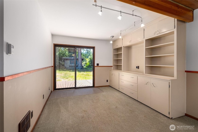 16757 Chilberg Ave, La Conner, WA 98257 - unfurnished room featuring light colored carpet, baseboards, and track lighting